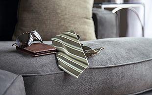 white and black stripe necktie on sofa HD wallpaper